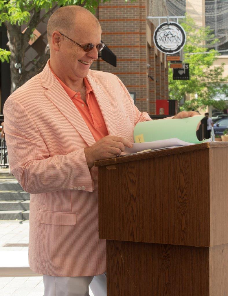 Robert Smith,  City of Lakewood, reads from the program